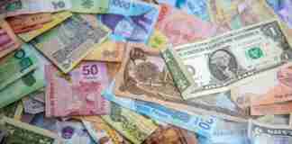 Money notes laid out on table
