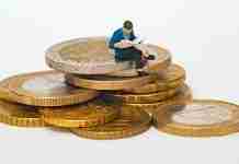 How to stay safe when buying on Alibaba (2025) Man sitting on coins