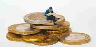 Man sitting on coins