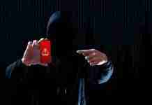 Android spyware found in 101 apps with 421 million installs can swipe private images Cybersecurity hacker pointing to smartphone for Spyware