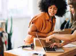 Amazon Individual vs. Professional Seller Account: Which should you choose? (2023) Two clothing store owners preparing some orders for Amazon shipping
