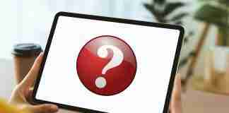 Person holding iPad with question mark