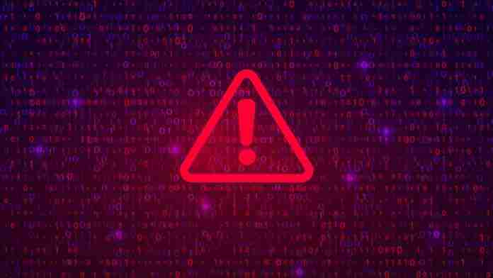 Cybercrime warning sign on binary background