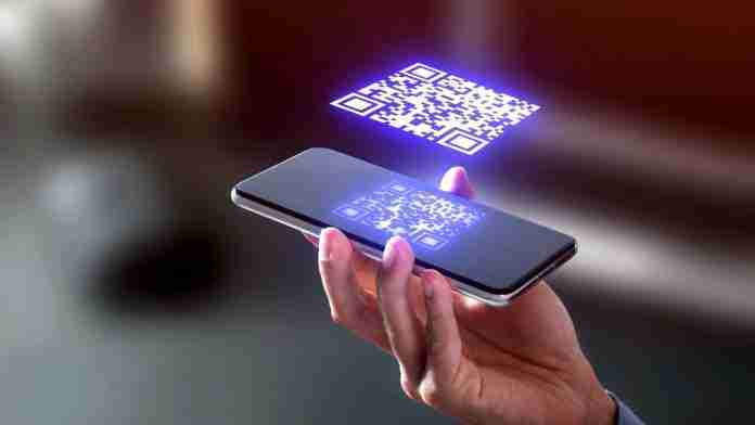 Pay or log in using QR code. QR code on phone concept